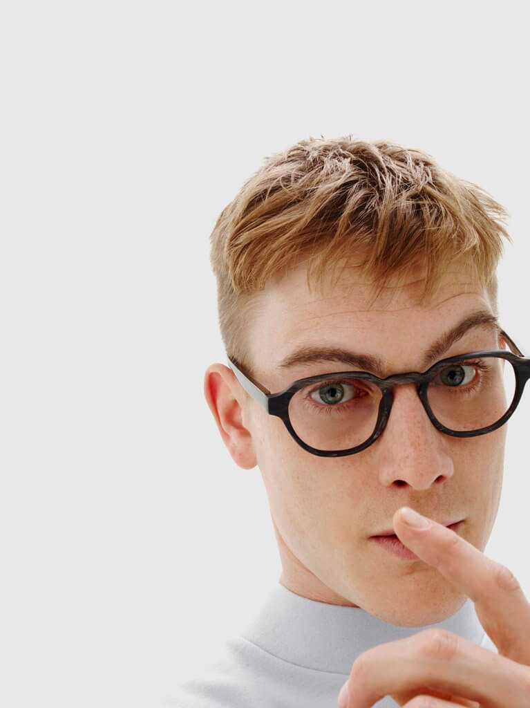 Male model wearing bespoke Tom Davies luxury glasses