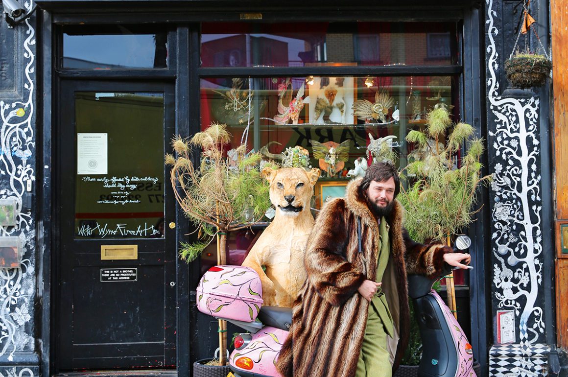 Portrait of artist Viktor Wynd outside of his museum in east London,