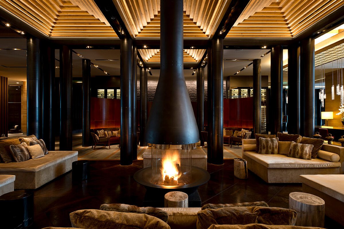 luxurious interiors of the Chedi Andermatt in Switzerland, designed to resemble a traditional chalet with Asian influences