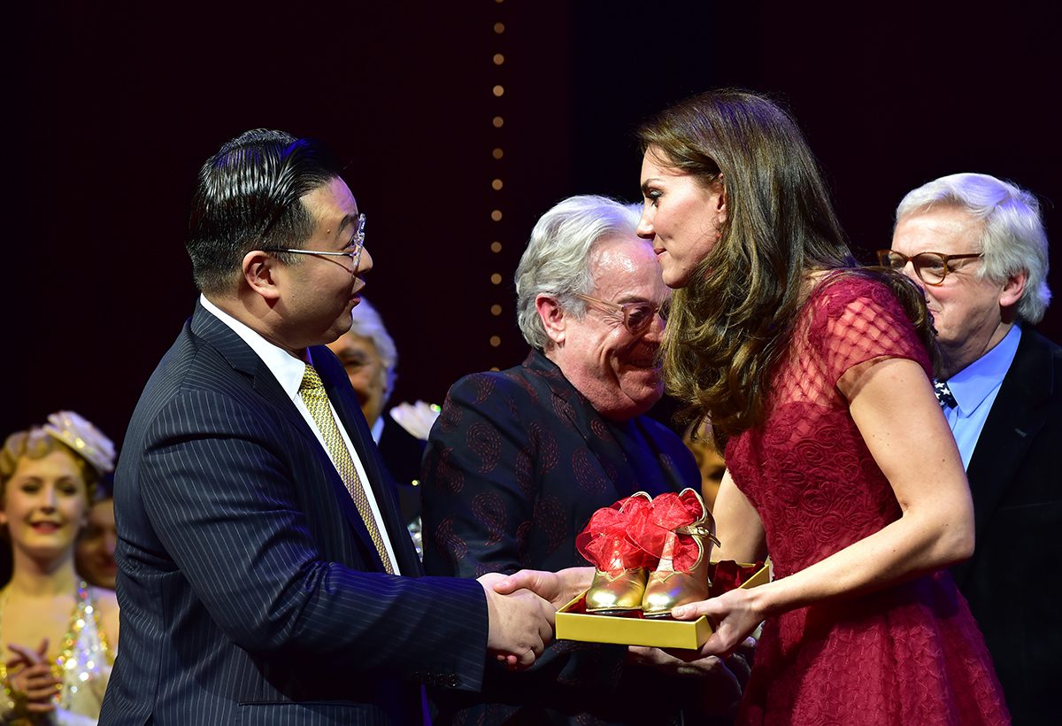 Global businessman Johnny Hon shakes hands with HRH The Duchess of Cambridge