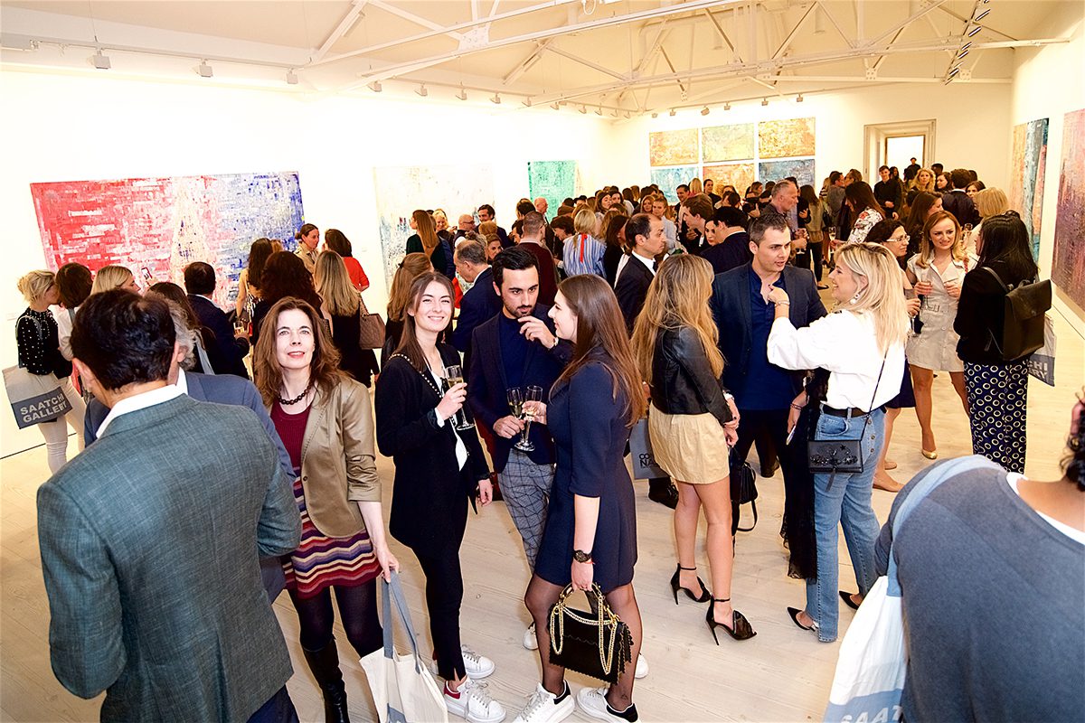 glamorous guests attend gallery opening