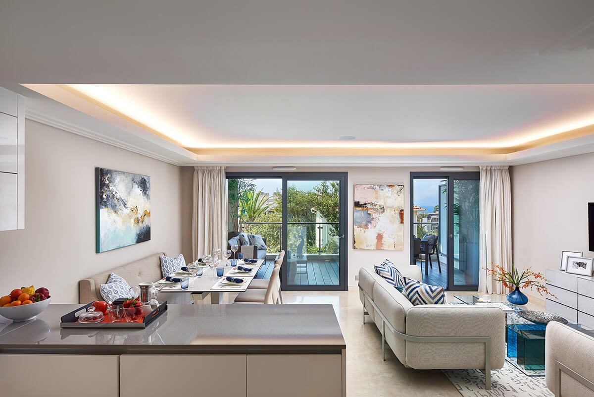 luxury apartment living room with siding doors onto a terrace and open plan kitchen living area