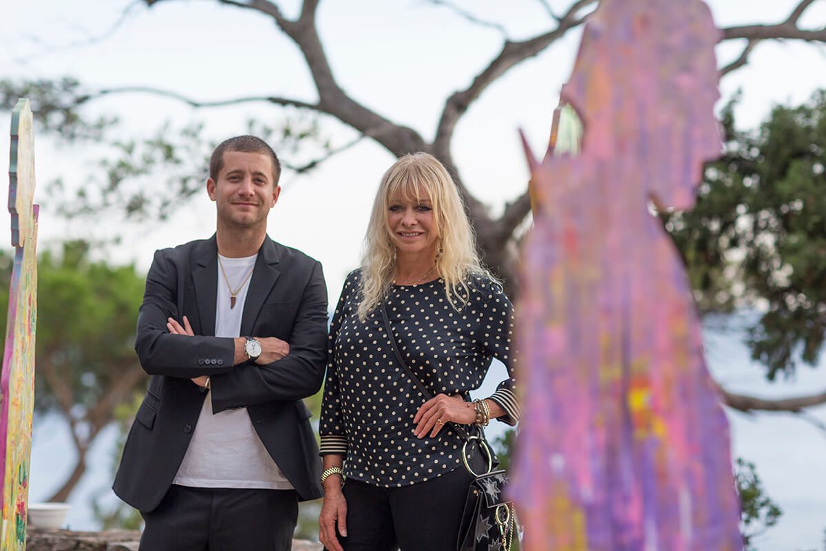 Model and TV personality Jo Wood poses with her son at art opening