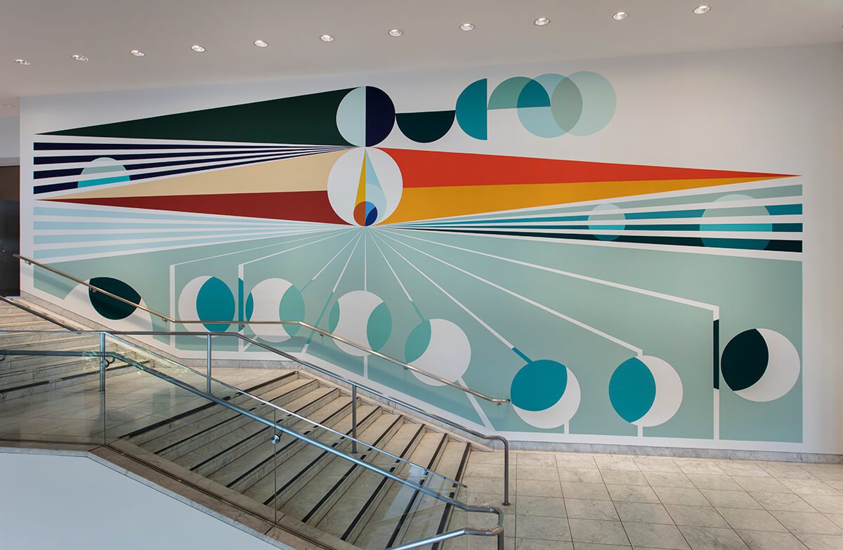 Colourful wall mural painted up the stairs