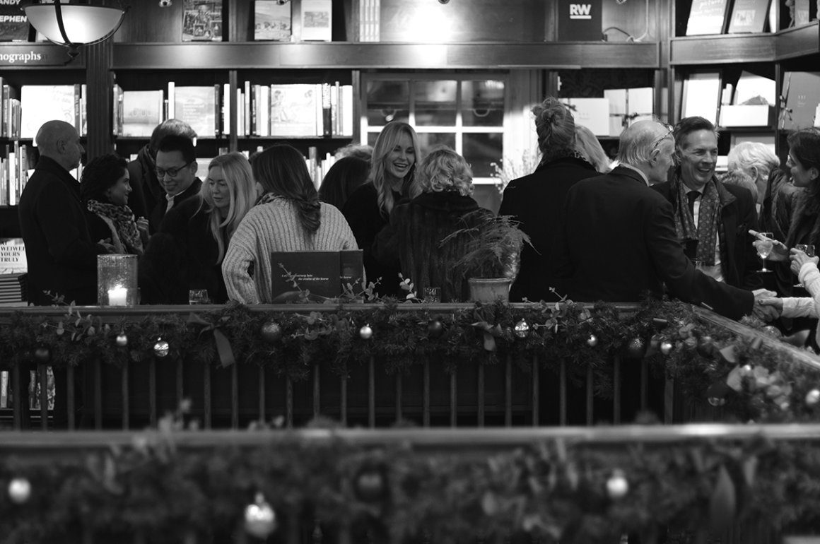 Book launch at Hatchard's London with Christmas decorations and guests chatting