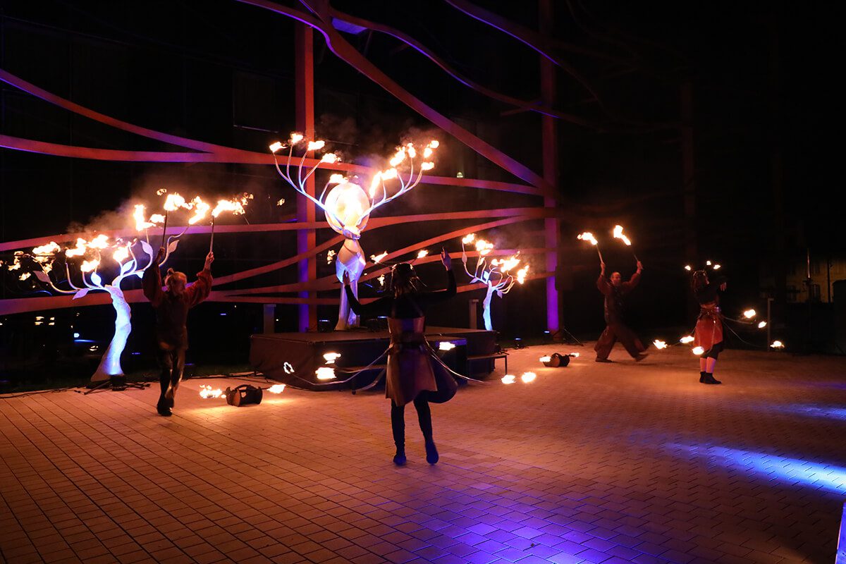 Dancers perform with flaming torches at opening celebration of luxury country hotel Chais Monnet