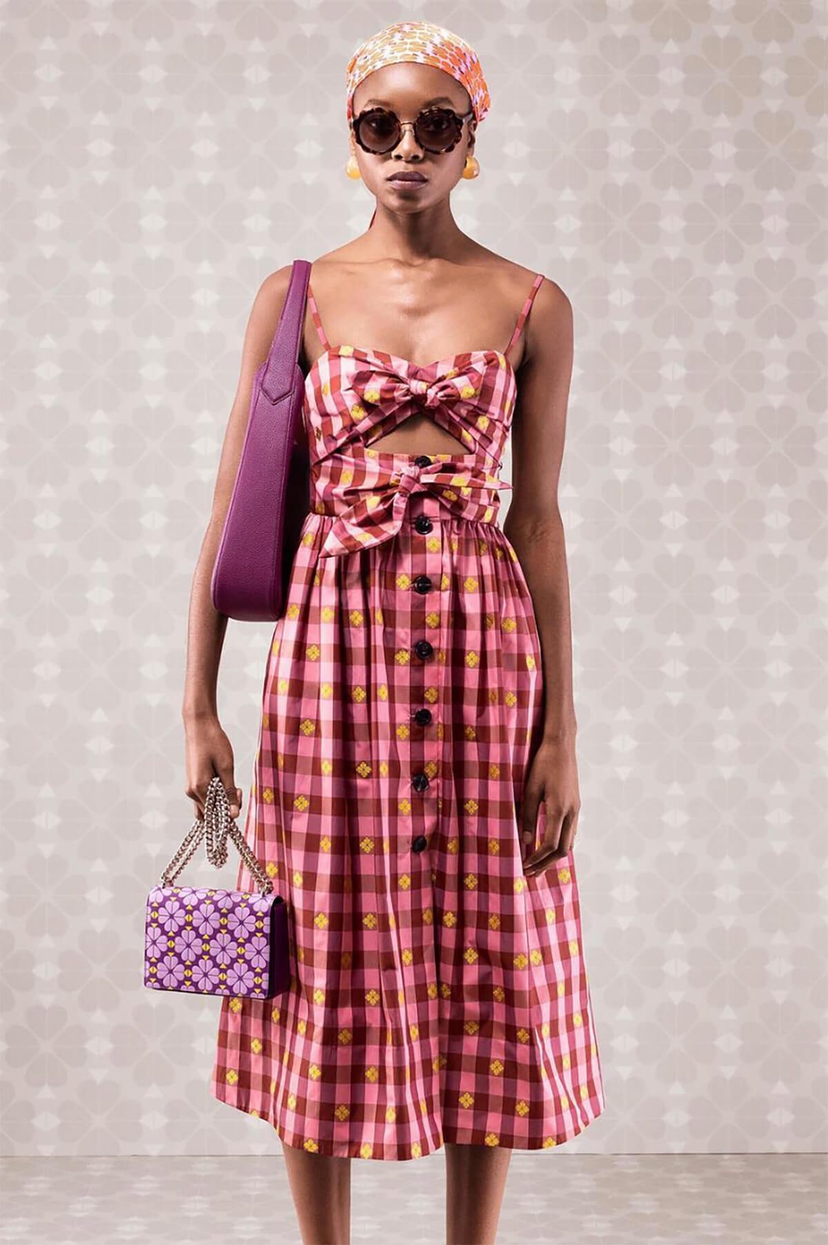 Kate Spade fashion campaign 2019 starring a female model wearing a patterned dress and sunglasses