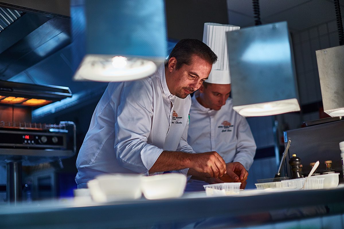A chef working in industrial kitchen