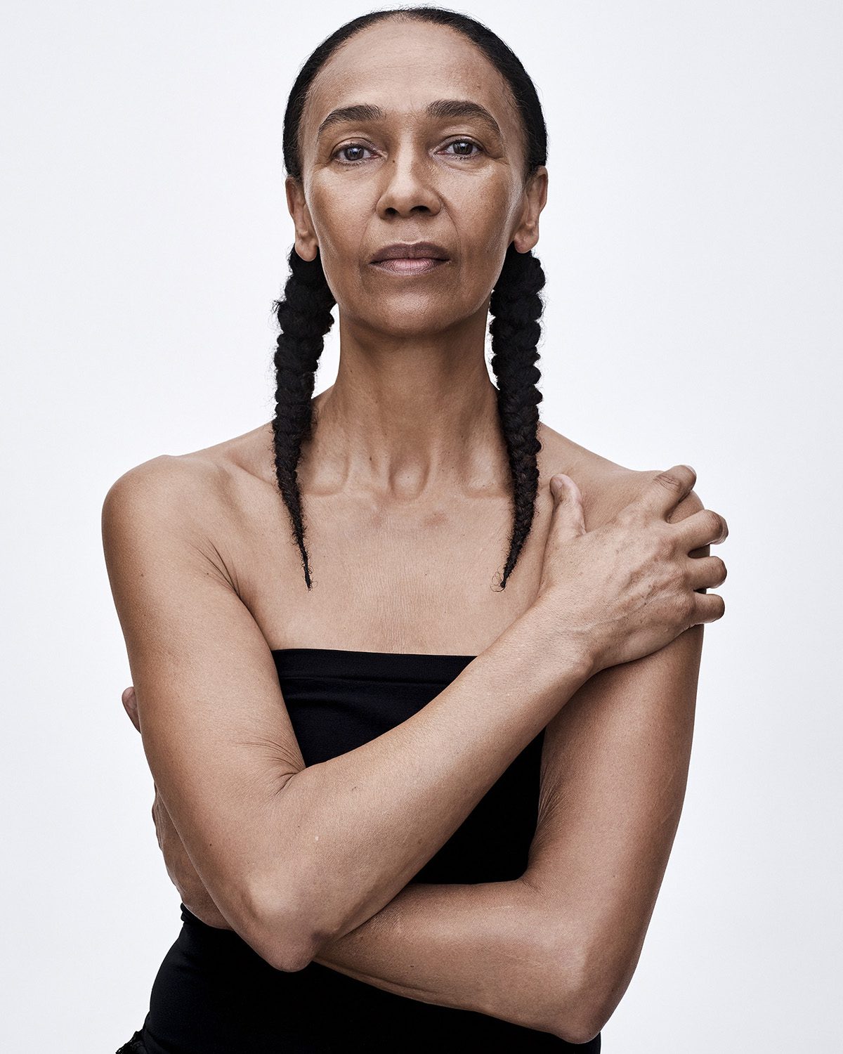 Portrait of mature mixed-race female model against a white background