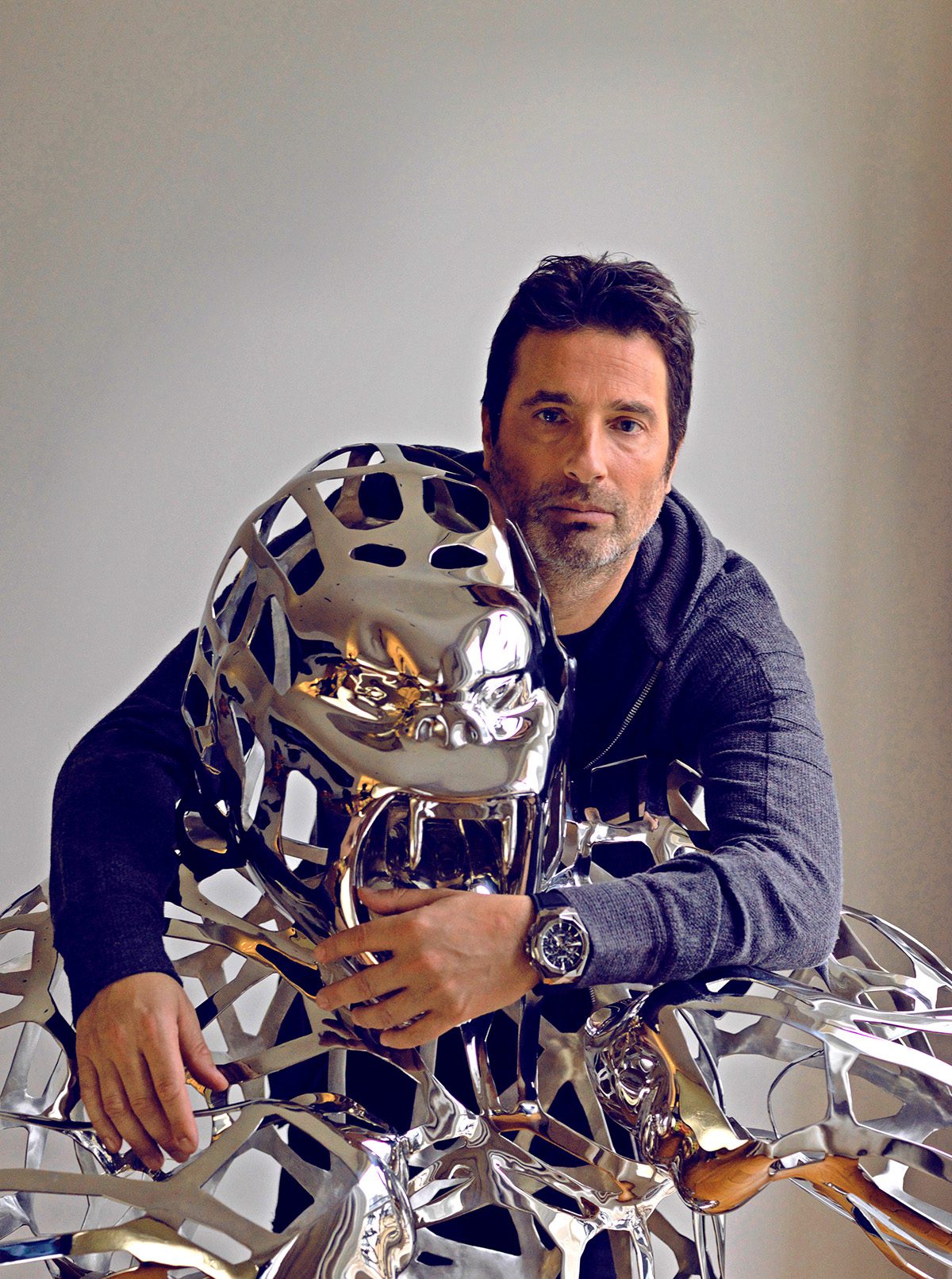 Portrait of artist Richard Orlinski with one of his sculptures 
