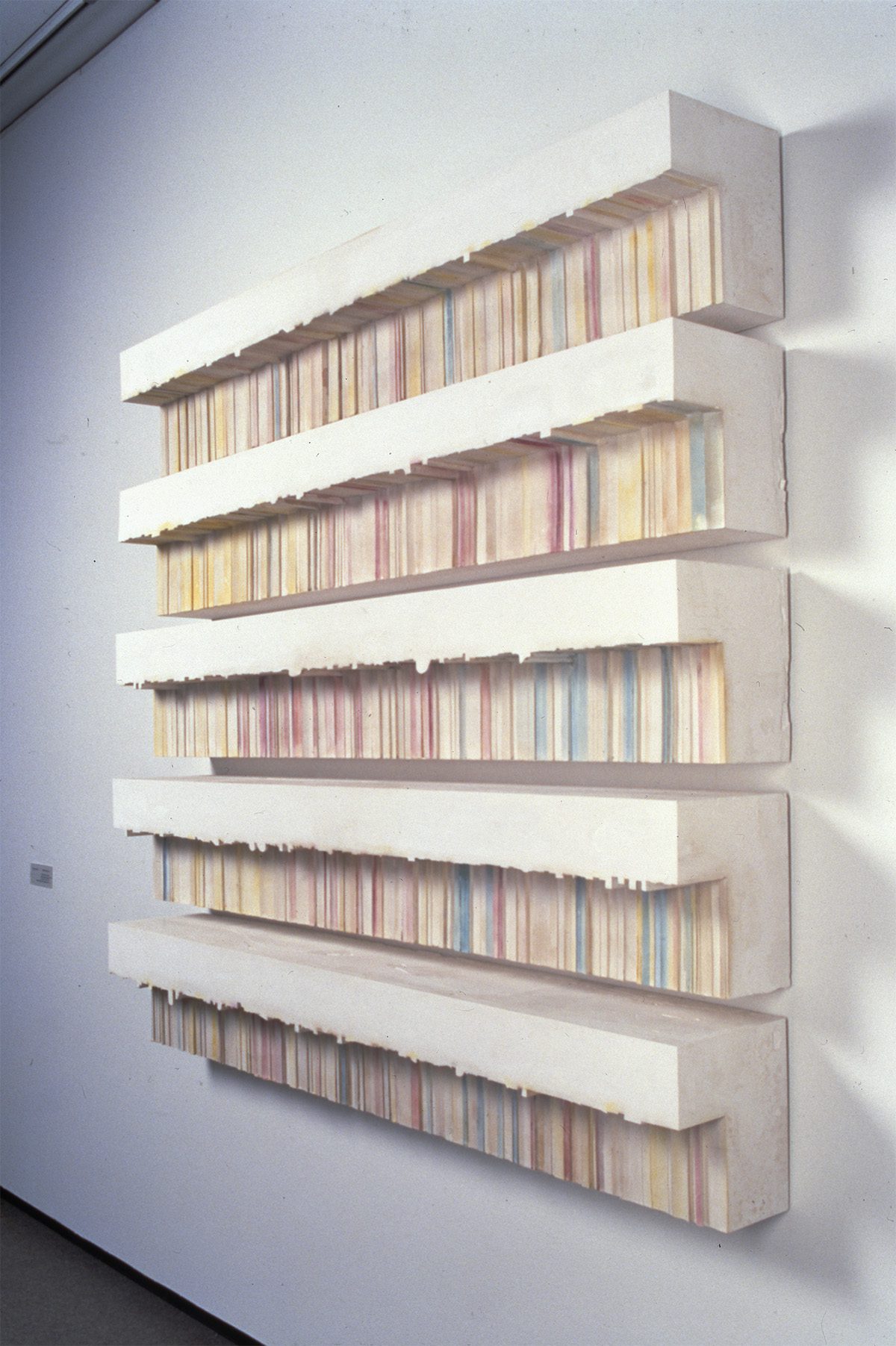 Large sculptural artwork hanging on a gallery wall