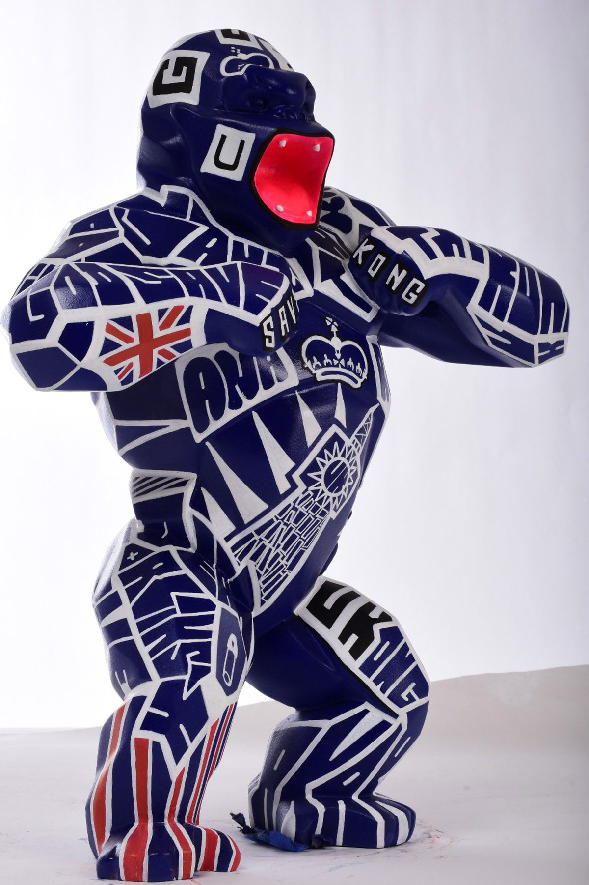 Large sculpture of a gorilla beating its chest