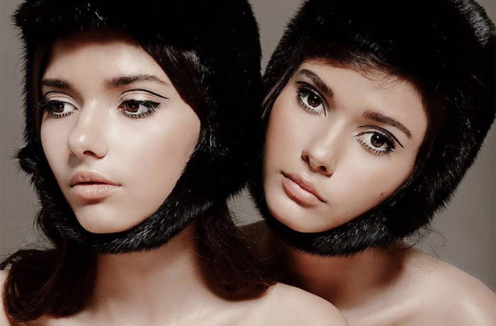 Twin models wearing helments