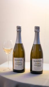Bottles of champagne and a glass