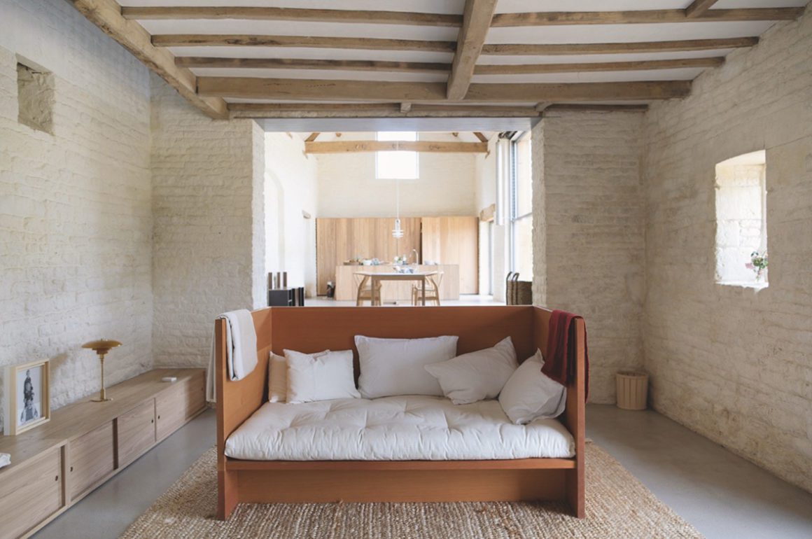 Open kitchen living space with exposed beams