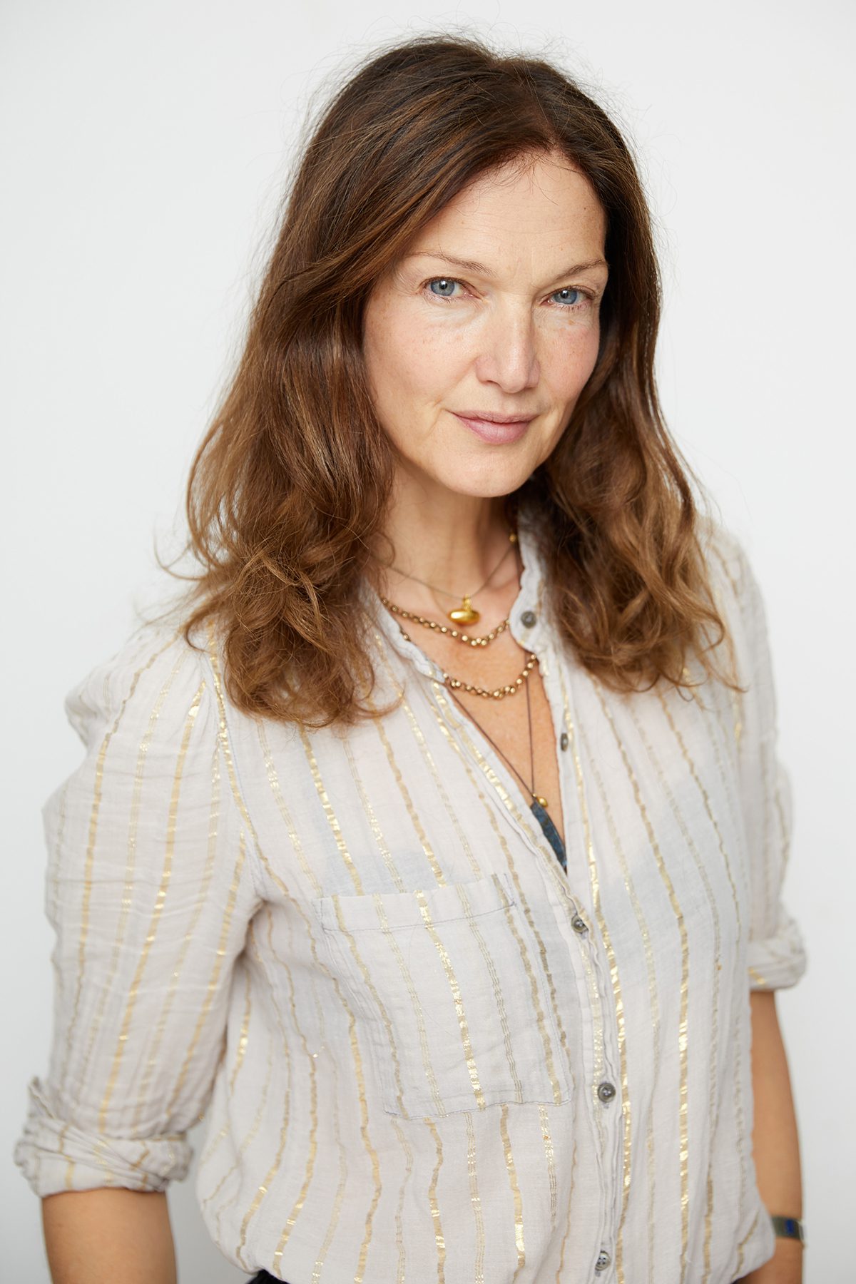 Middle aged woman posing in studio setting