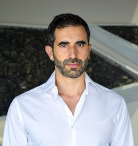 Man in white shirt with beard