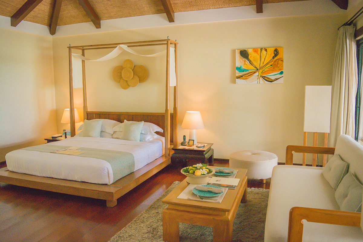 Luxurious hotel bedroom decorated in yellow