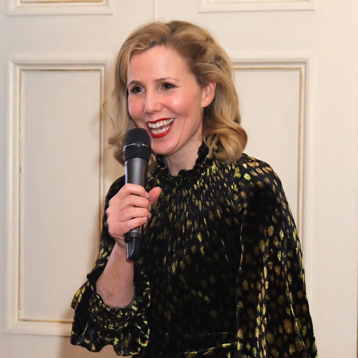 actress giving a speech with a microphone