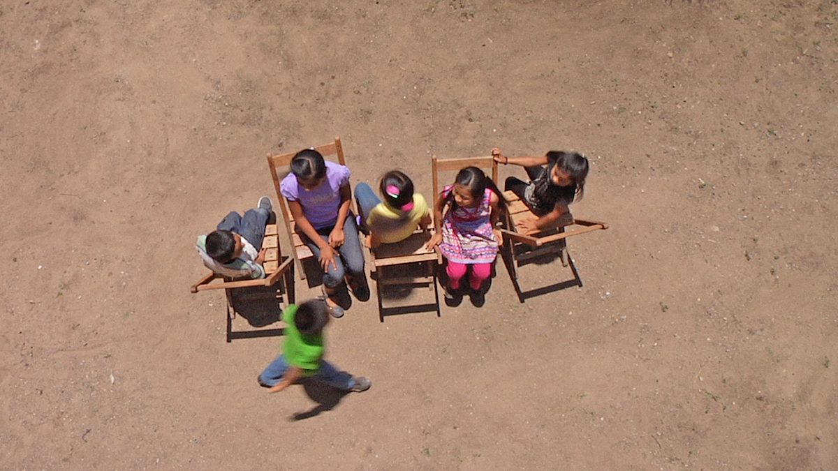 Children playing musical chairs