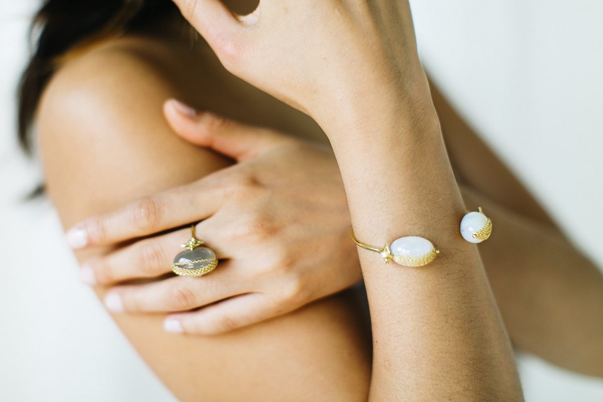 Model wearing bracelet and ring
