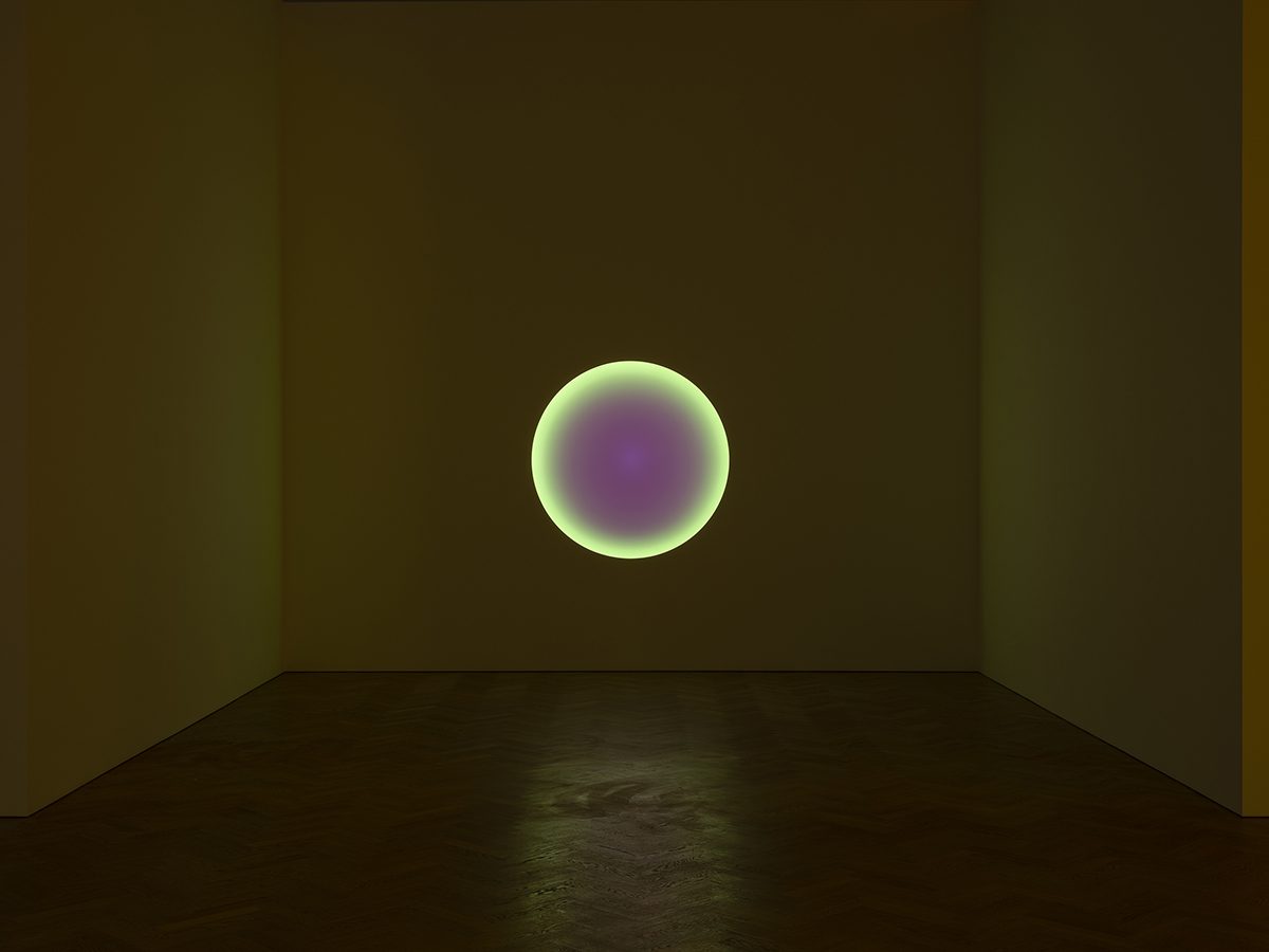 glowing light on wall in gallery