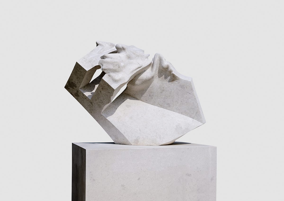 Abstract marble sculpture on column