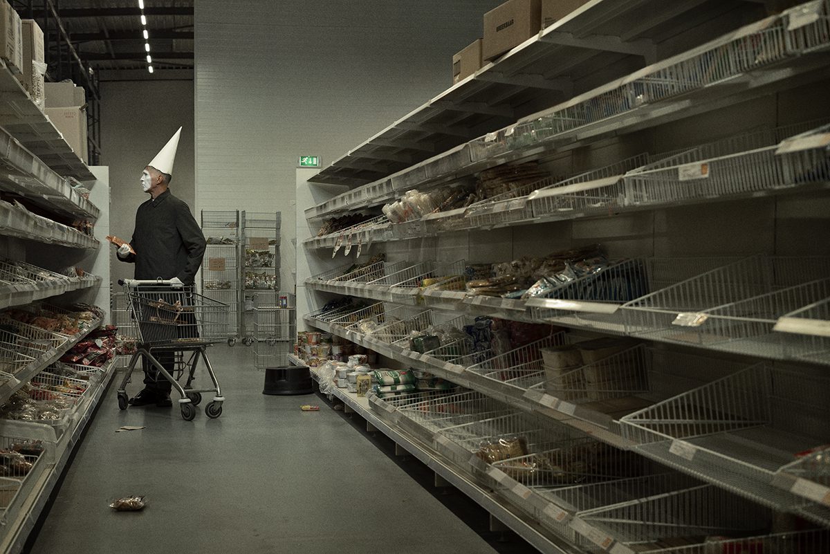 Man pushing empty trolley