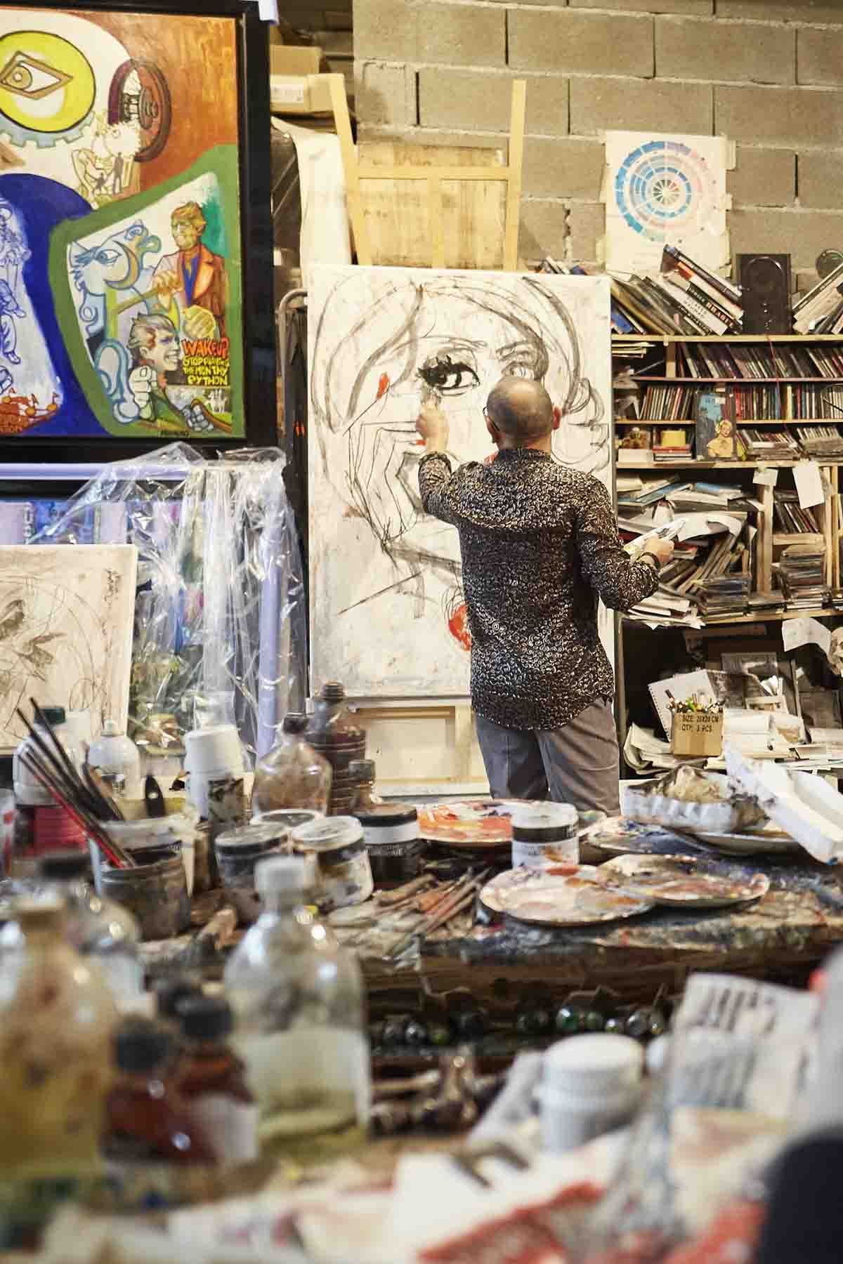 Artist painting in studio