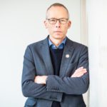 man wearing blazer and glasses