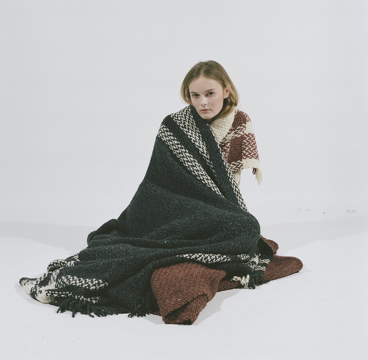 woman wrapped in blankets