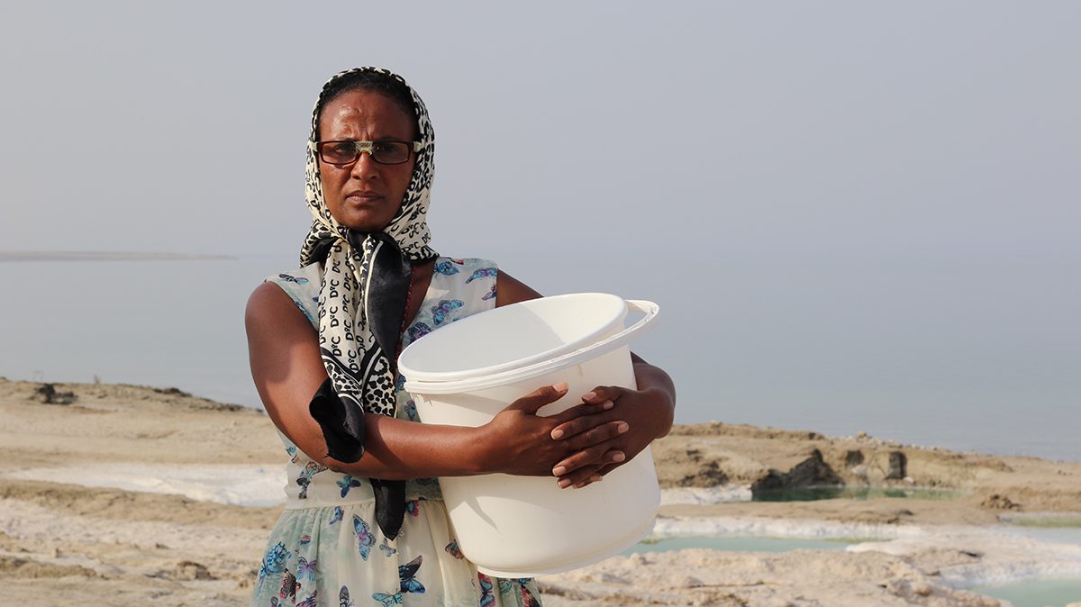 woman holding bucket