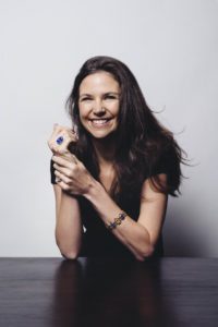 woman wearing blue ring