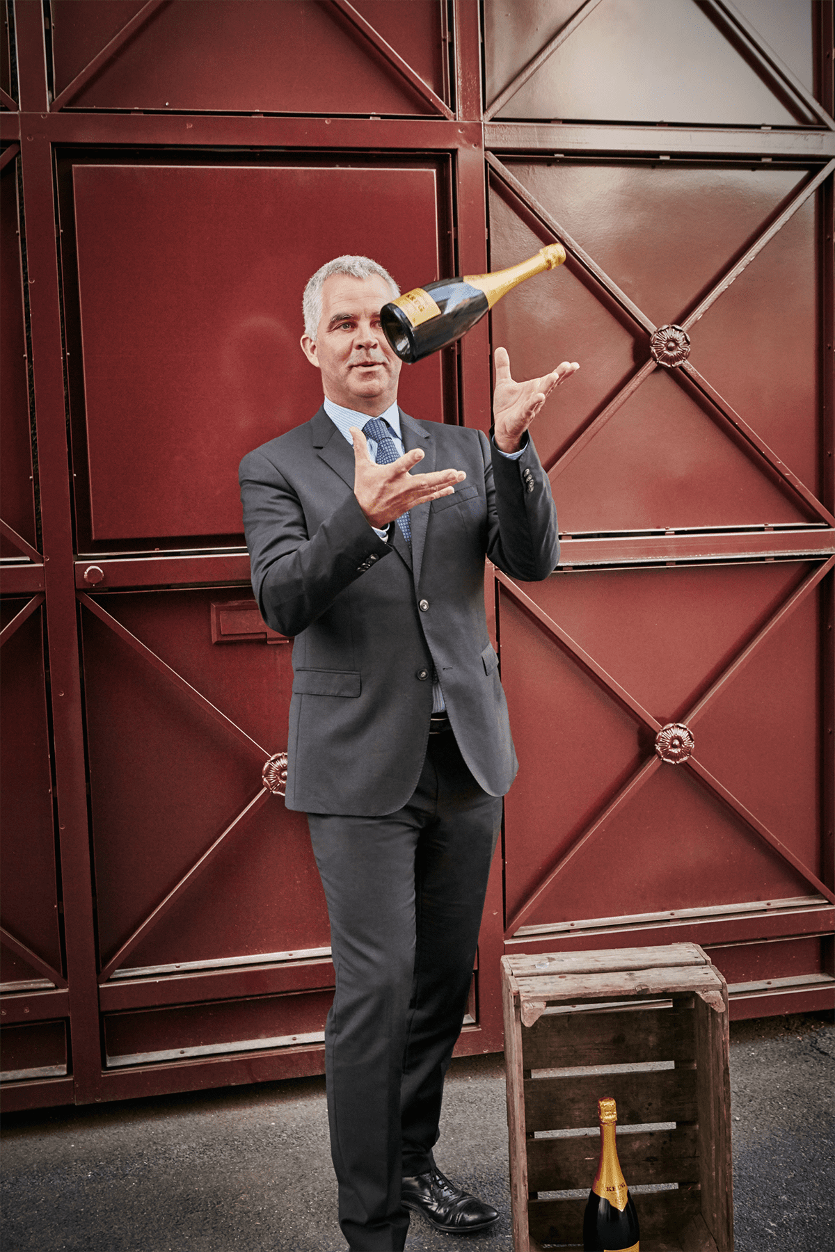 man juggling champagne