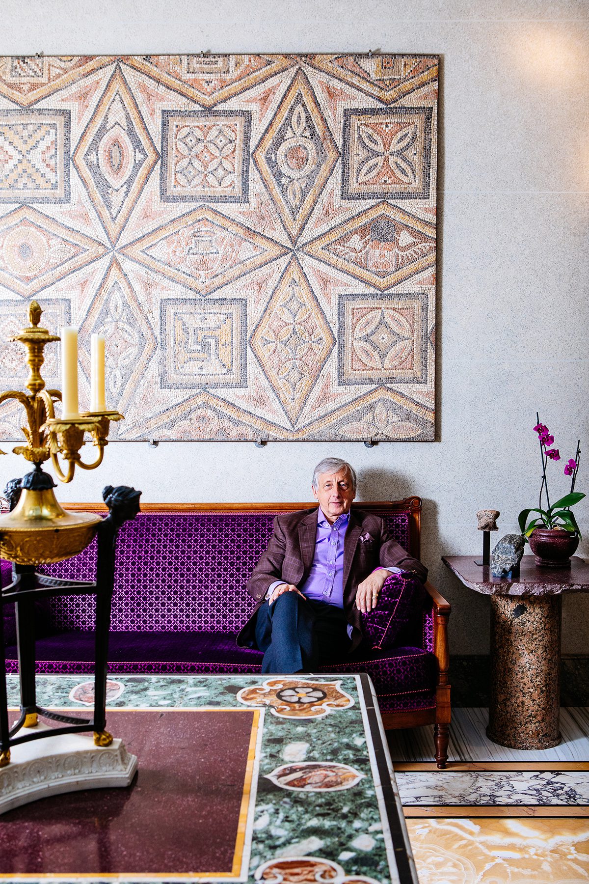 man surrounded by art