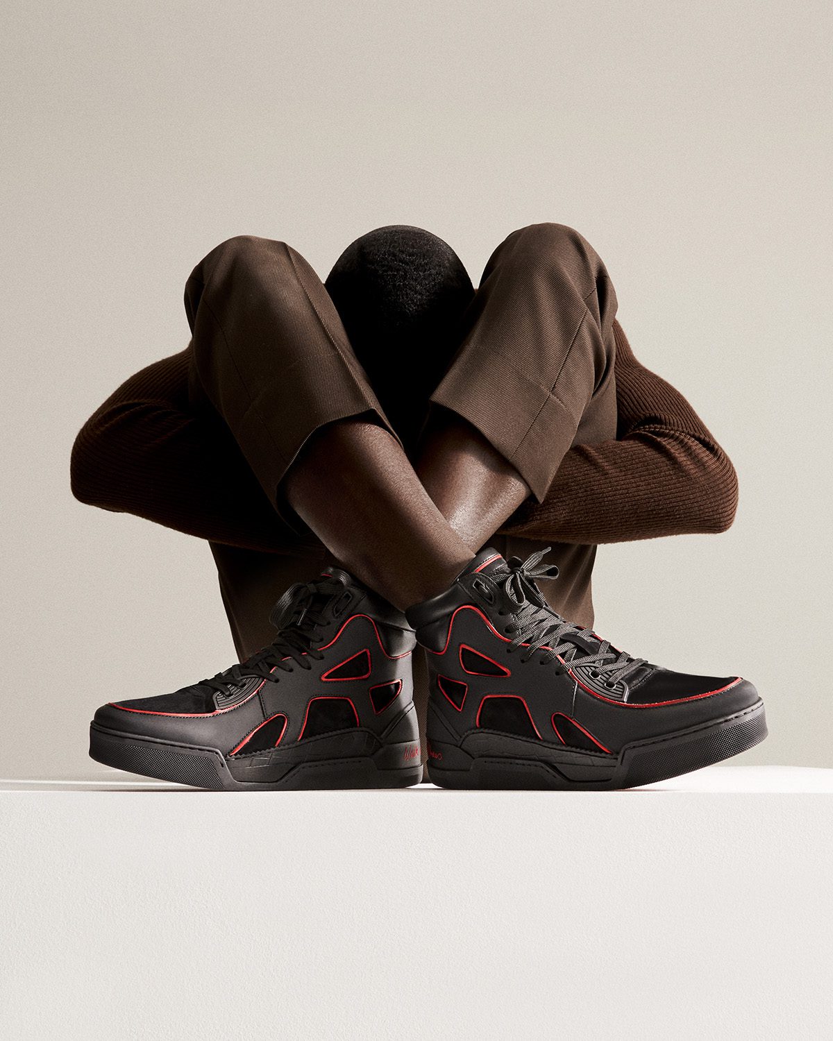 model wearing black trainers