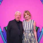 man and woman in front of artwork