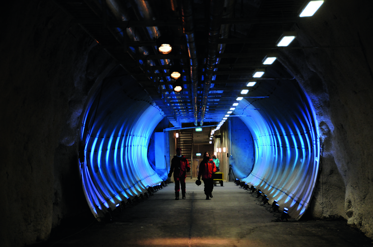 man and woman walking through tunnel