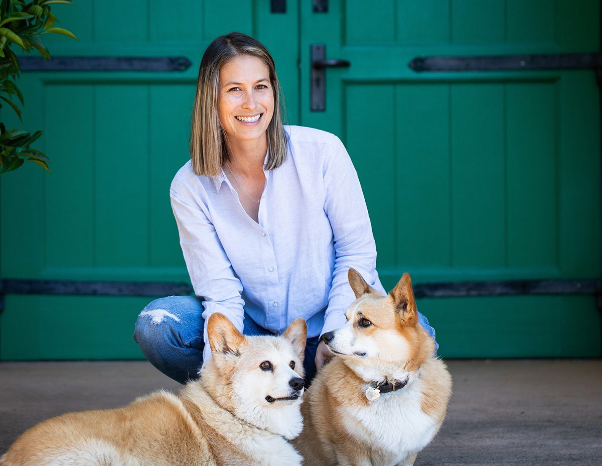 a woman with two dogs