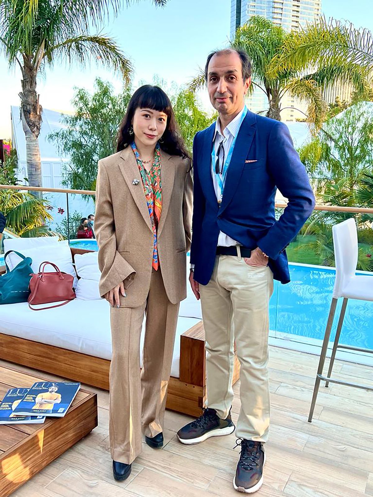 a man and woman standing on a terrace