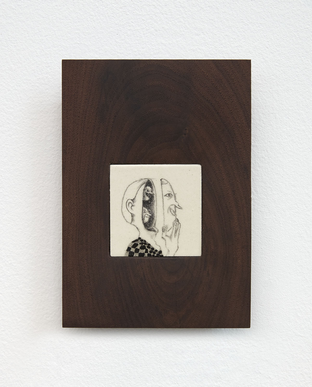 A drawing of a man taking off his face on a dark wooden cavas