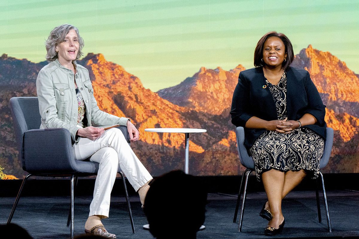 two women sitting on a panel