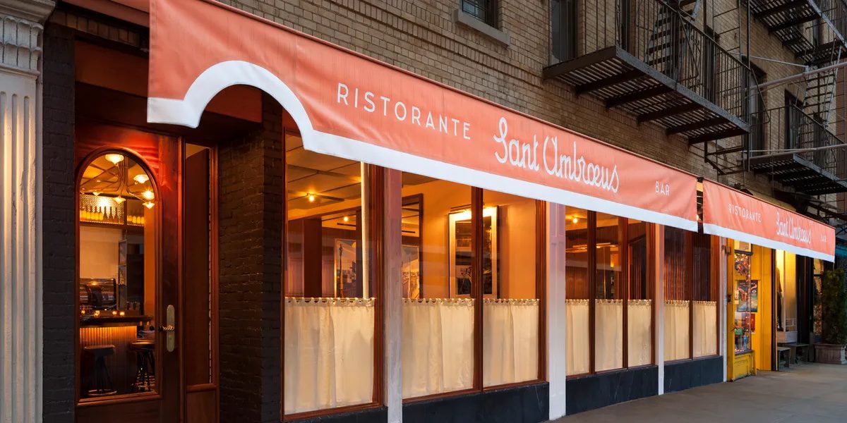 An orange awning with white writing