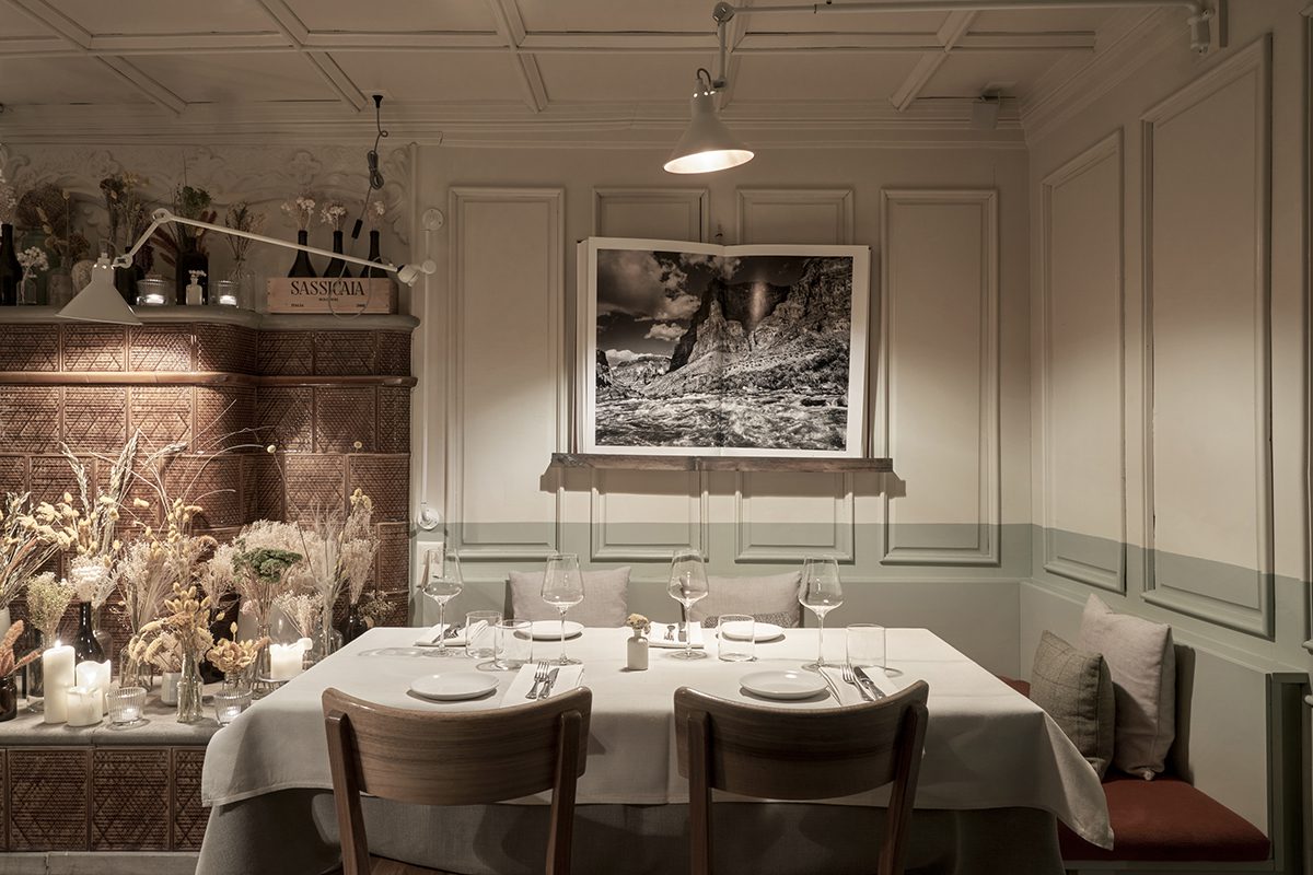 A table set with beige and green walls