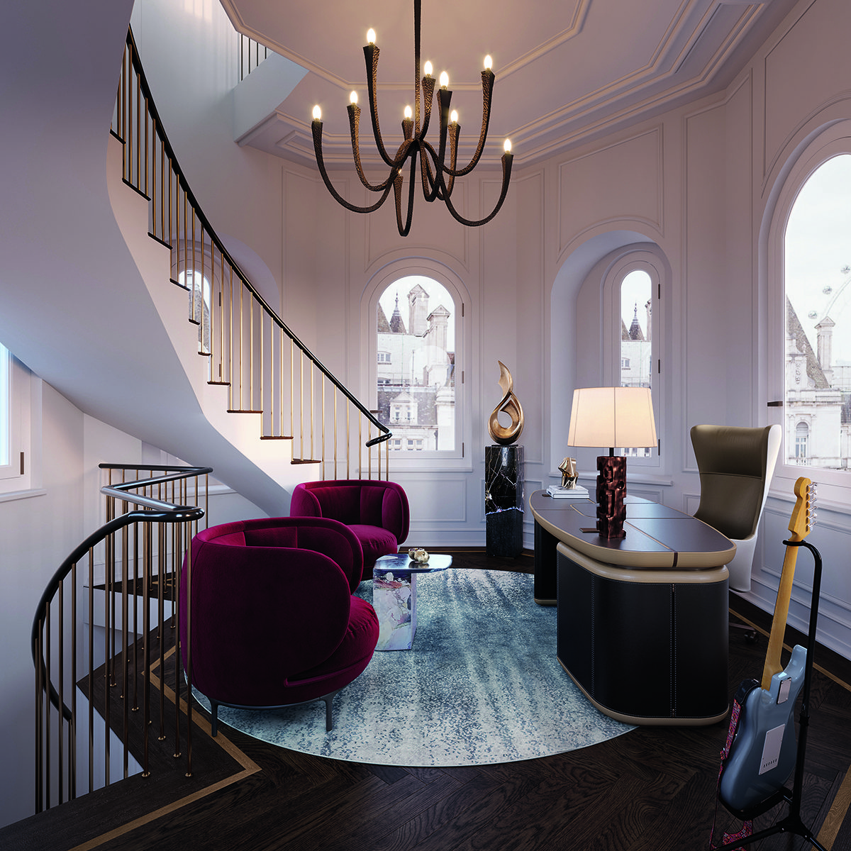 red velvet chairs on a landing with a curved brown staircase