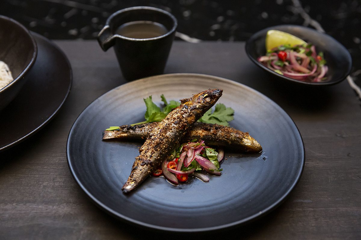 eggplant prepared on a black plate