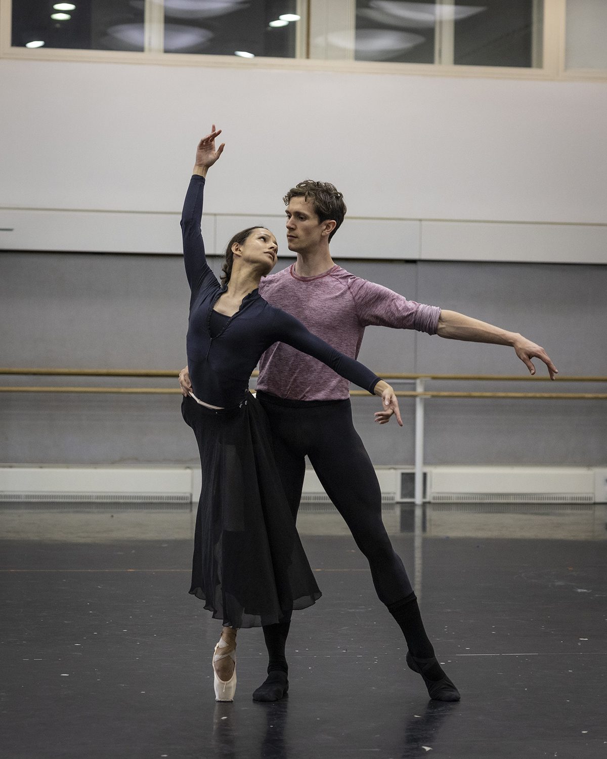 Two ballerinas training in a studio