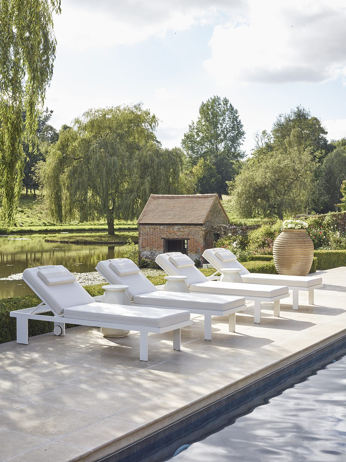 HyperFocal: 0 white deckchairs in front of a hut and grass