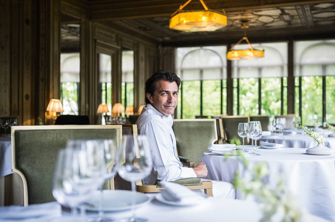 a chef sitting at a table
