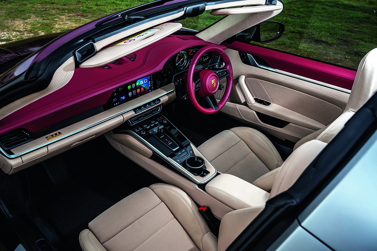 White leather seats and red hardware in a car
